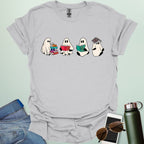 Ghost Readers t-shirt with ghost reading books graphic — spooky Halloween tee for book lovers, teachers, and readers who love a good ghost story.