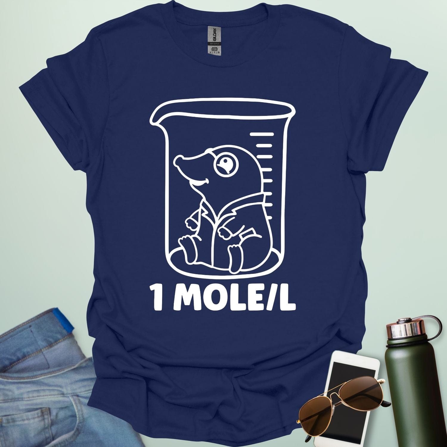 A funny chemistry t-shirt featuring a cartoon mole inside a science beaker. The design includes the text '1 MOLE/L,' a clever pun for chemists and science students.