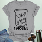 A funny chemistry t-shirt featuring a cartoon mole inside a science beaker. The design includes the text '1 MOLE/L,' a clever pun for chemists and science students.