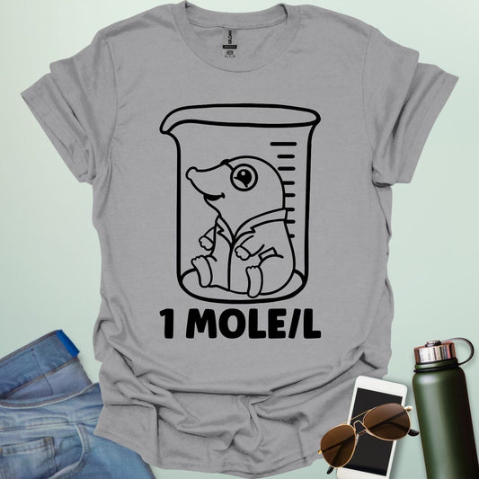 A funny chemistry t-shirt featuring a cartoon mole inside a science beaker. The design includes the text '1 MOLE/L,' a clever pun for chemists and science students.