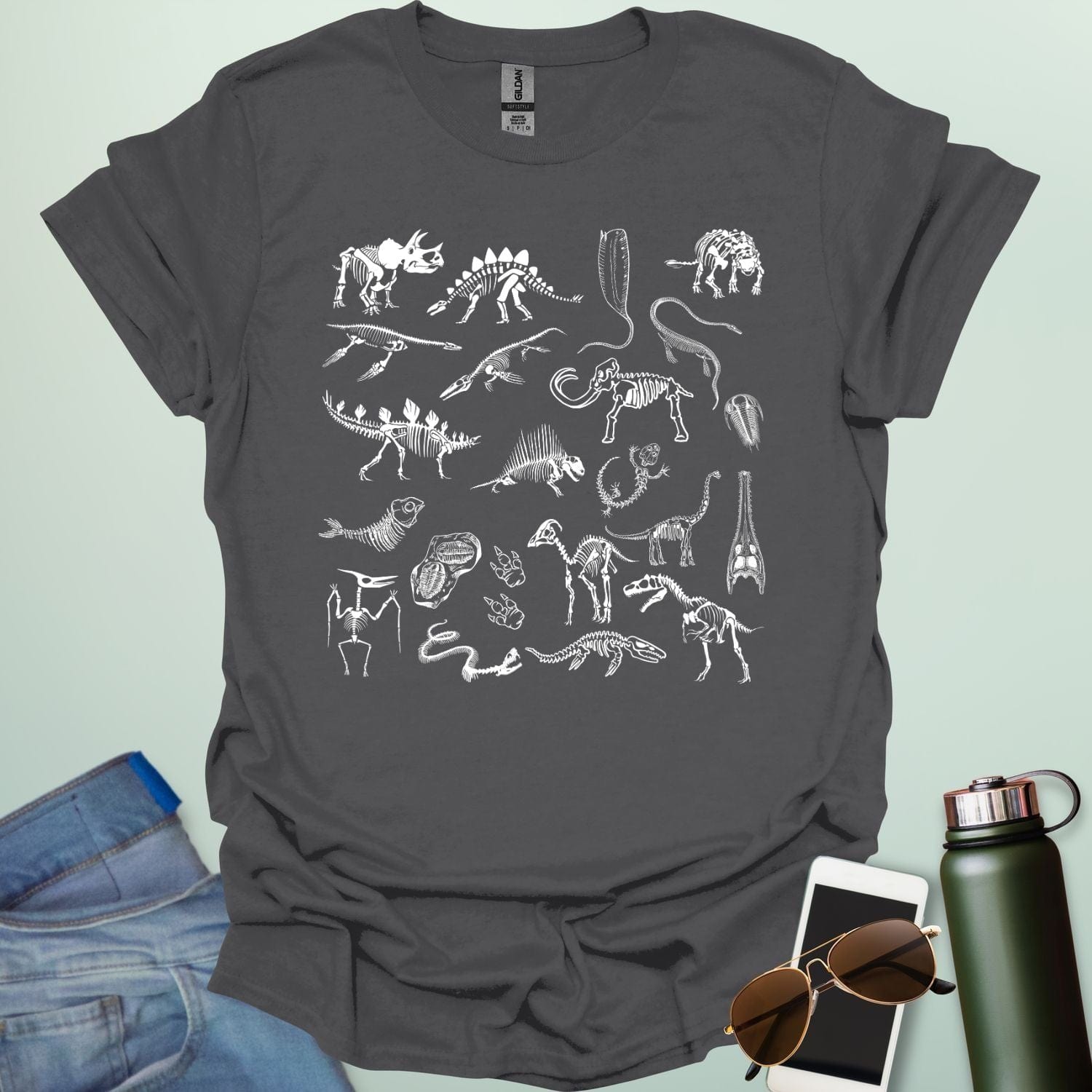 A collage of various fossil skeletons, including dinosaurs, prehistoric mammals, and invertebrates, arranged in a square or block pattern.
