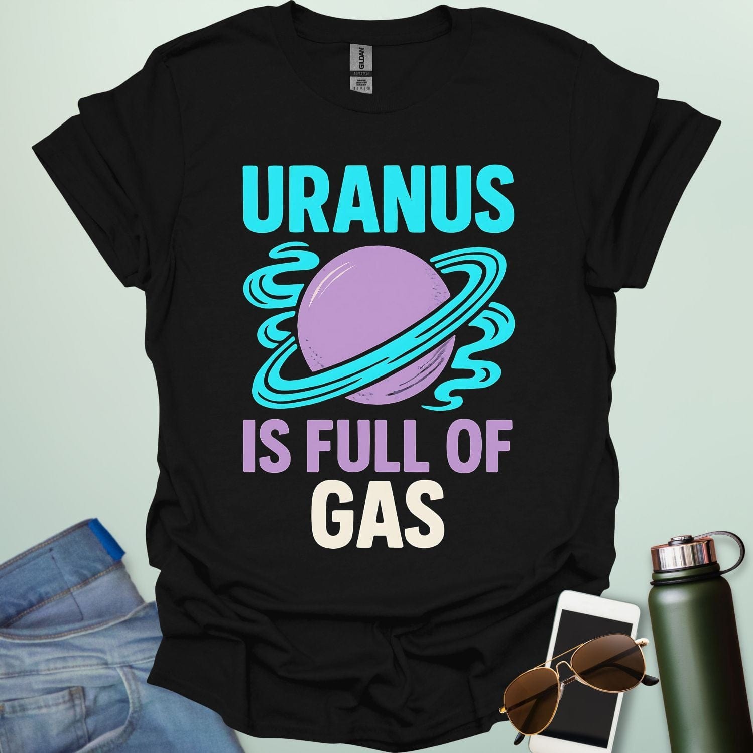 Graphic of the planet Uranus with fun typography reading “Uranus Is Full of Gas” — a humorous astronomy / space pun on a dark background.