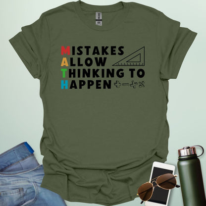 A military green t-shirt with the text 'MISTAKES ALLOW THINKING TO HAPPEN,' with the first letter of each word forming 'MATH' vertically, and a ruler and math symbols.