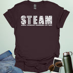 Dark chocolate tee with the word 'STEAM' with each letter filled with related icons, and the words 'SCIENCE TECHNOLOGY ENGINEERING ART MATH' below.