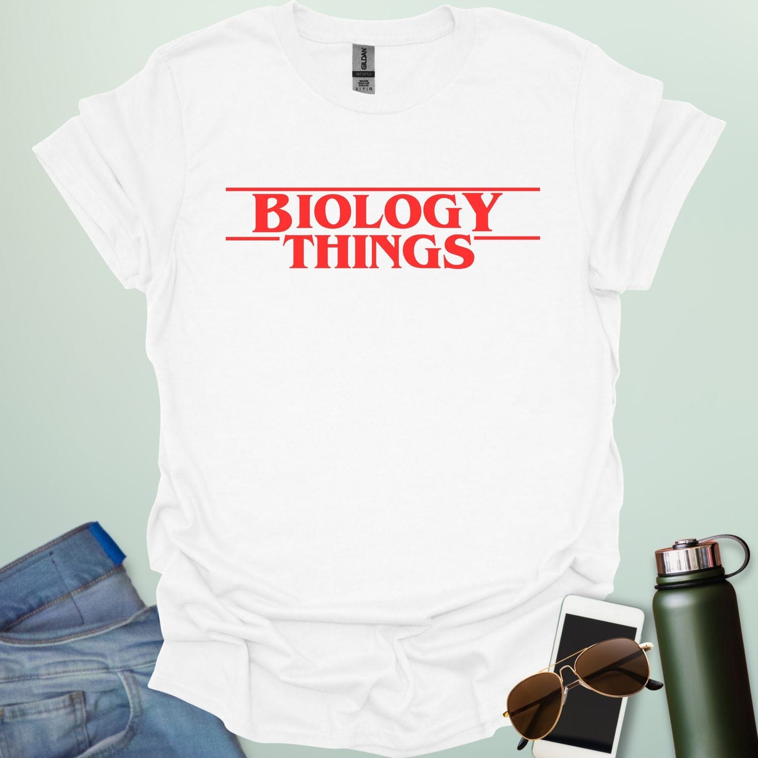 The words 'BIOLOGY' stacked above 'THINGS' in a red, stylized font with horizontal lines above and below, as a parody of the 'Stranger Things' logo.