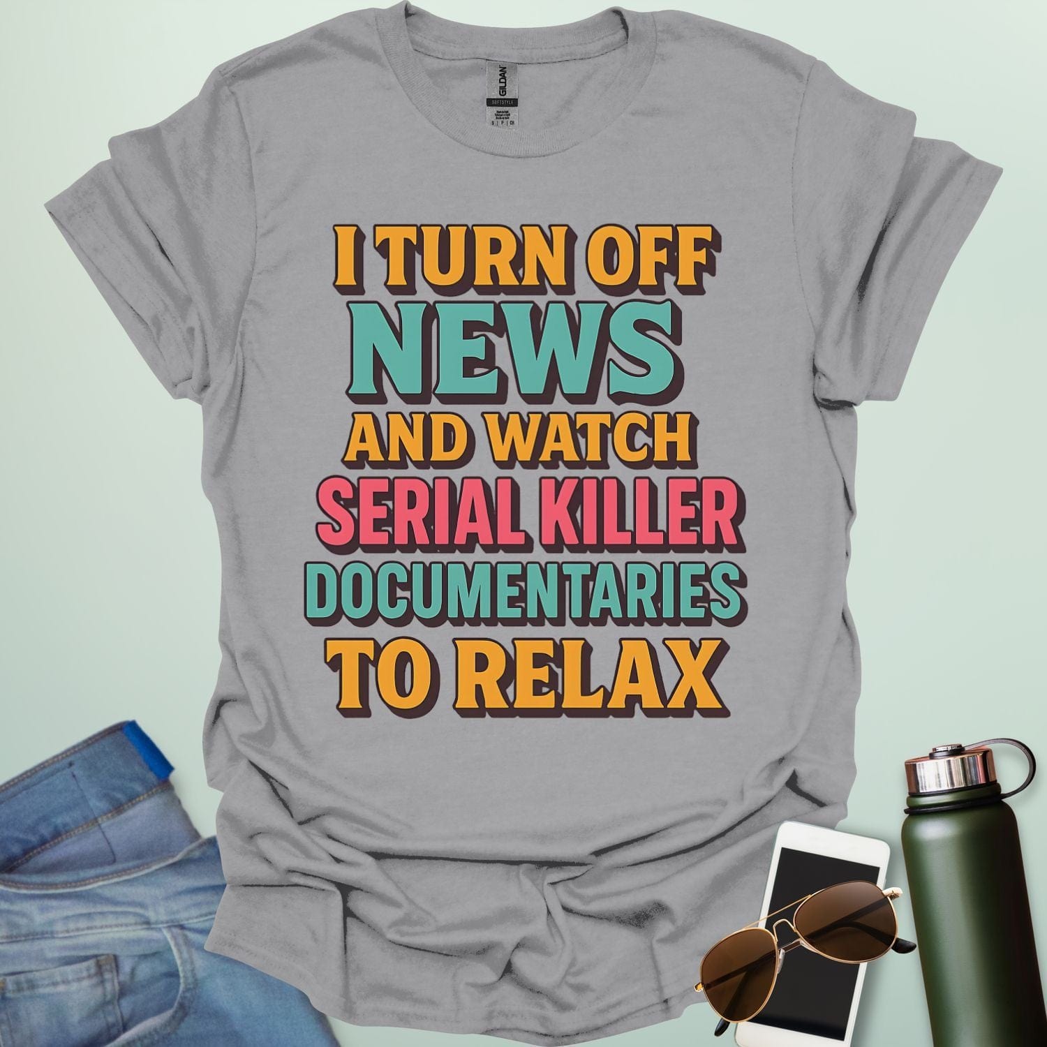‘I Turn Off News & Watch Serial Killer Documentaries To Relax’ t-shirt with bold typography — humorous true crime statement tee.