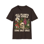 Detailed botanical illustration of toxic flora—including foxglove, lily of the valley, and fly agaric mushrooms—surrounding a human skull and bones, with bold text reading 'ALL PLANTS ARE EDIBLE... SOME ONLY ONCE'.