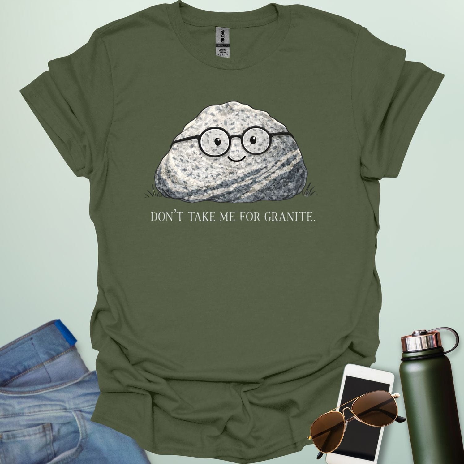 A playful science graphic featuring a cartoon rock character with a smiling face alongside the punny text "DON'T TAKE ME FOR GRANITE."