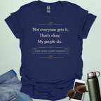 T-shirt with navy blue text reading 'Not everyone gets it. That's okay. My people do.' and 'STEM: SPEAK FLUENT CURIOSITY' with atom icons."