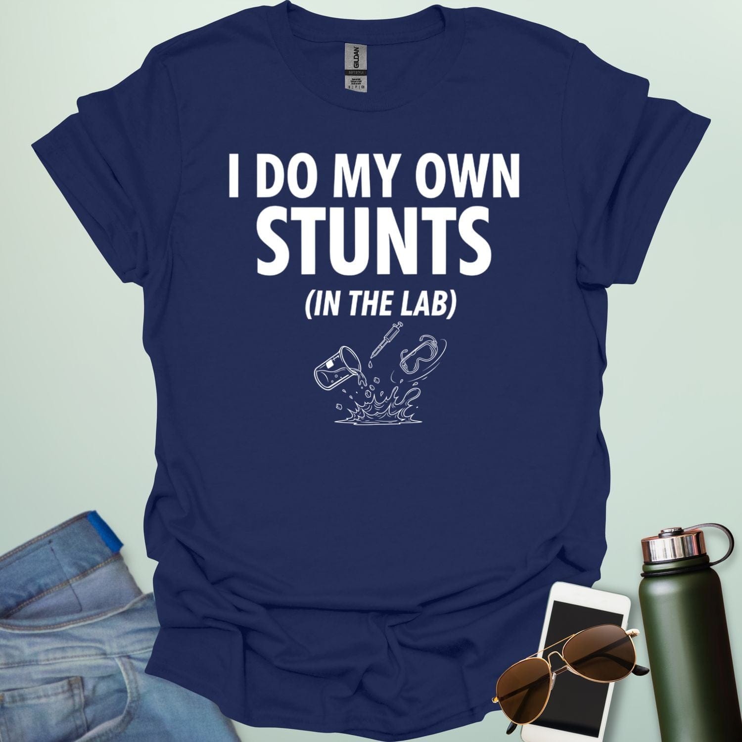 A bold graphic design featuring the text "I DO MY OWN STUNTS" in a large, blocky font with the subtext "(IN THE LAB)" positioned underneath.
