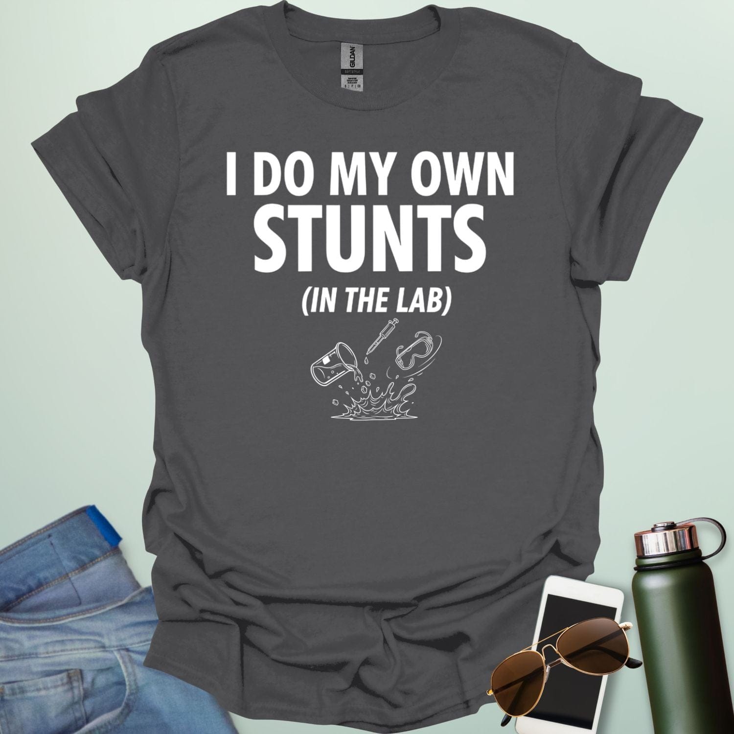 A bold graphic design featuring the text "I DO MY OWN STUNTS" in a large, blocky font with the subtext "(IN THE LAB)" positioned underneath.