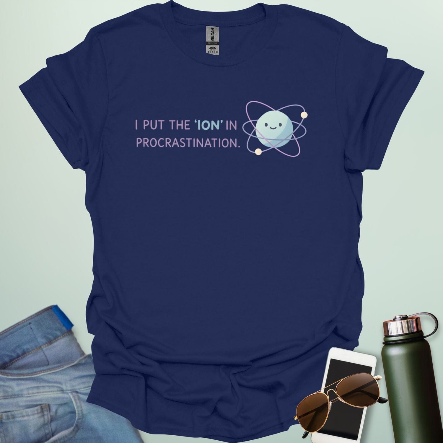 A playful science graphic featuring an atom or ion illustration with the punny text "I PUT THE 'ION' IN PROCRASTINATION" in a modern, rounded typeface.