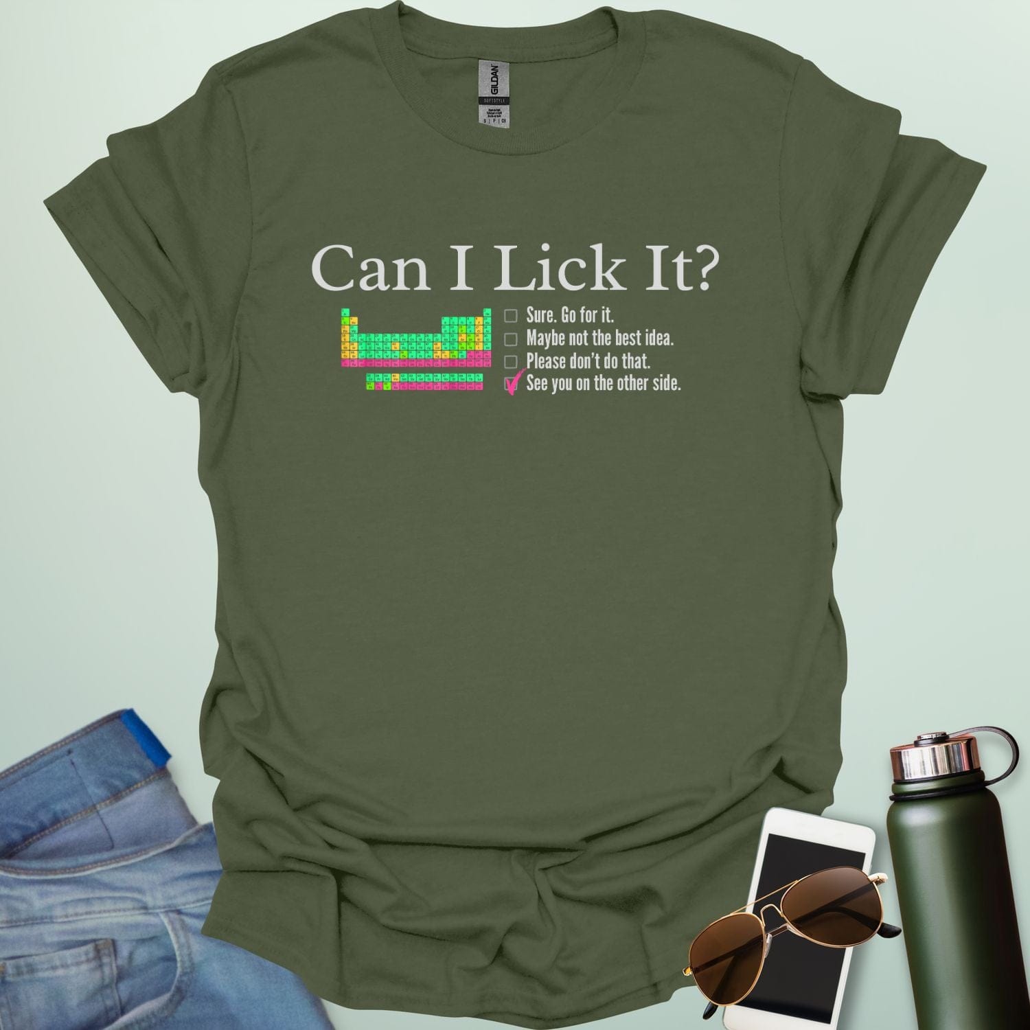 A playful science-themed graphic featuring the question "CAN I LICK IT?" in bold letters above a periodic table element-style box