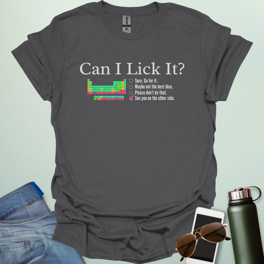 A playful science-themed graphic featuring the question "CAN I LICK IT?" in bold letters above a periodic table element-style box