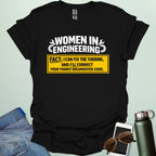 Graphic design featuring the text 'WOMEN IN ENGINEERING' with wrench and gear icons above a yellow box reading 'FACT: I CAN FIX THE TURBINE, AND I’LL CORRECT YOUR POORLY DOCUMENTED CODE.'