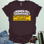 Graphic design featuring the text 'WOMEN IN ENGINEERING' with wrench and gear icons above a yellow box reading 'FACT: I CAN FIX THE TURBINE, AND I’LL CORRECT YOUR POORLY DOCUMENTED CODE.'