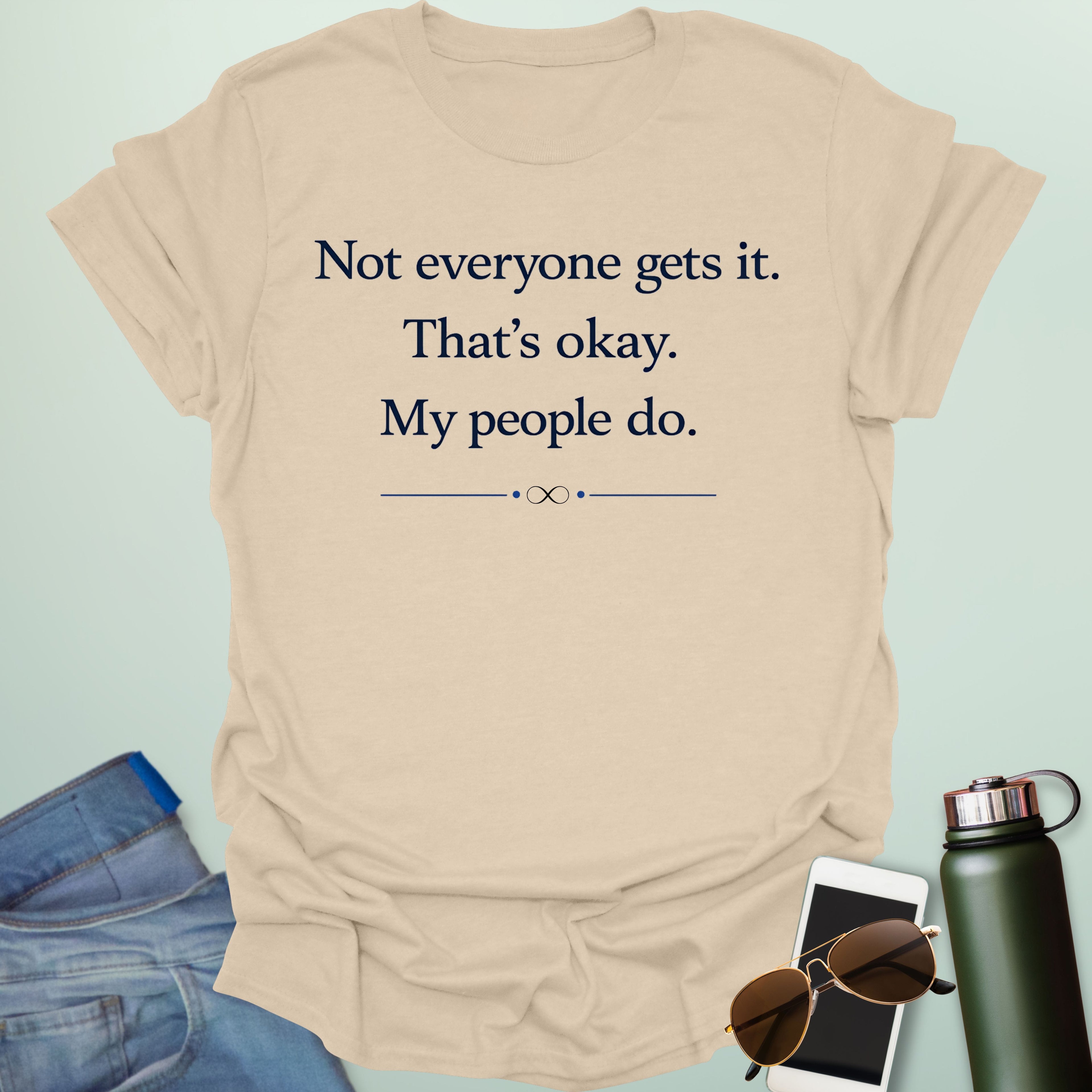 Graphic design featuring clean serif text reading 'Not everyone gets it. That's okay. My people do.' framed above a subtle infinity symbol.