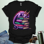Dragon Fantasy t-shirt featuring whimsical purple dragon curled on a stack of books — perfect for fantasy fans, book lovers, and story geeks.