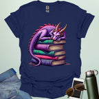 Dragon Fantasy t-shirt featuring whimsical purple dragon curled on a stack of books — perfect for fantasy fans, book lovers, and story geeks.