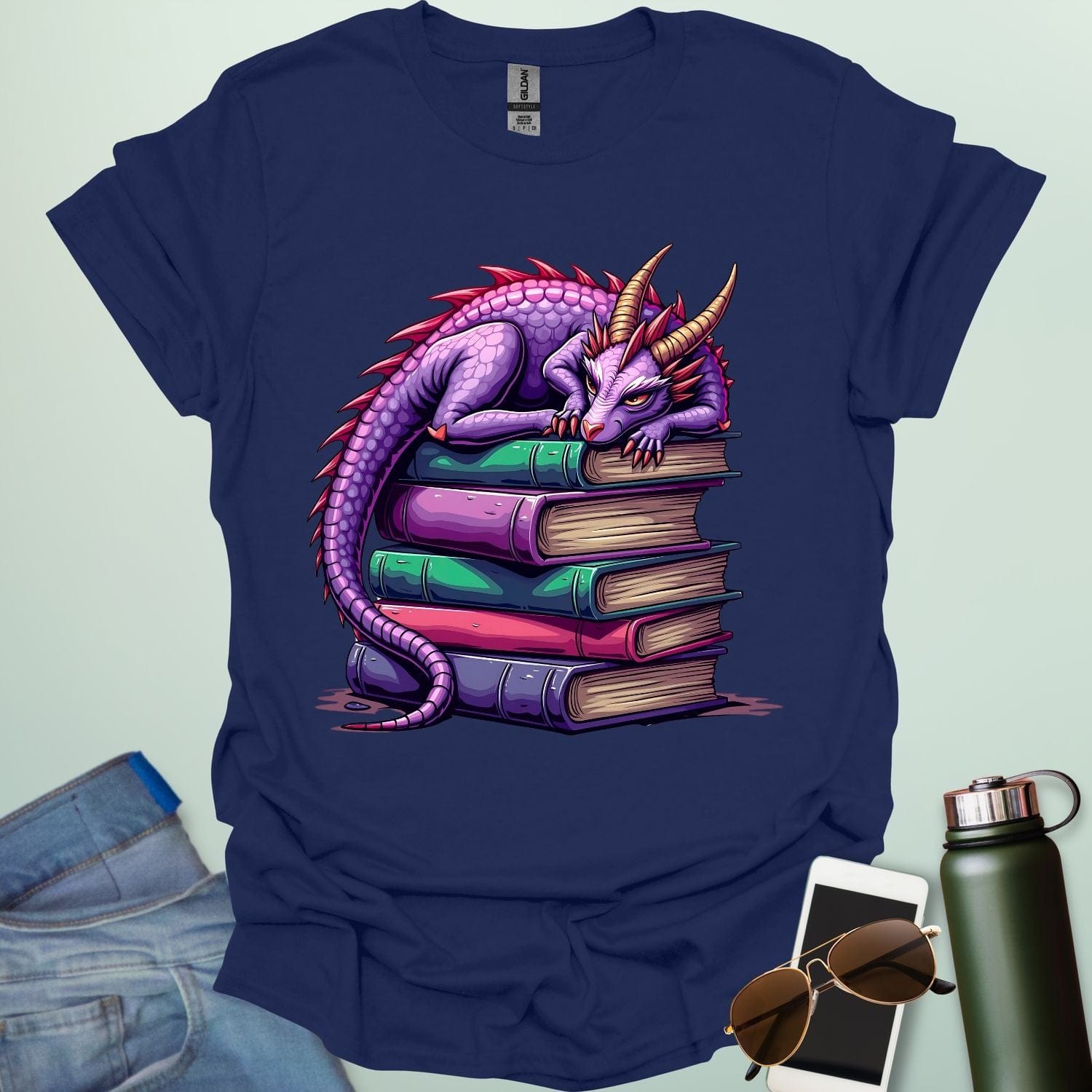 Dragon Fantasy t-shirt featuring whimsical purple dragon curled on a stack of books — perfect for fantasy fans, book lovers, and story geeks.
