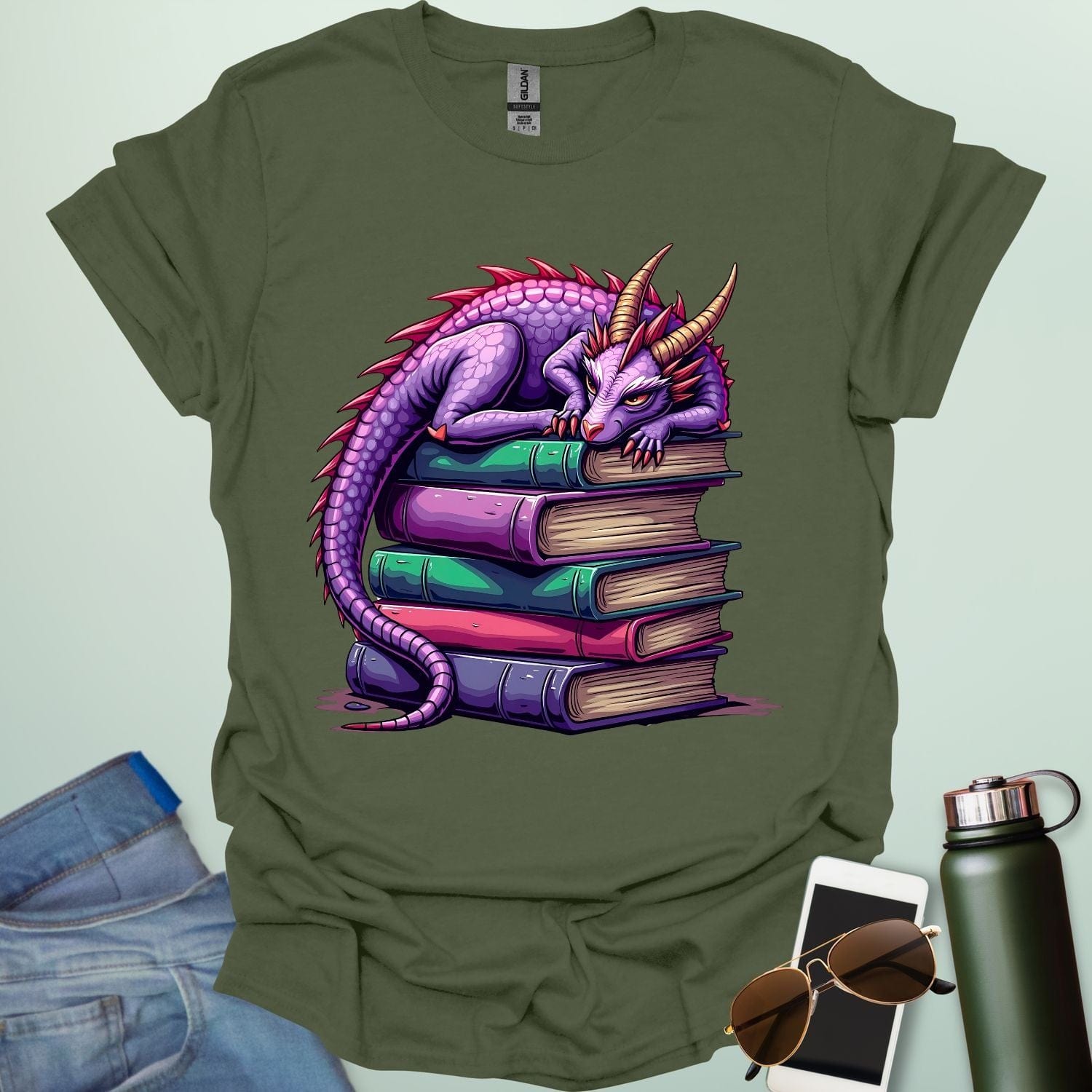 Dragon Fantasy t-shirt featuring whimsical purple dragon curled on a stack of books — perfect for fantasy fans, book lovers, and story geeks.