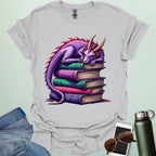 Dragon Fantasy t-shirt featuring whimsical purple dragon curled on a stack of books — perfect for fantasy fans, book lovers, and story geeks.