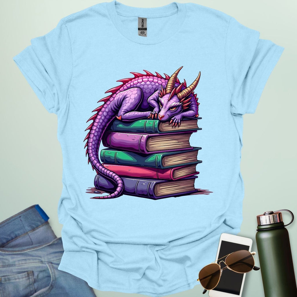 Dragon Fantasy t-shirt featuring whimsical purple dragon curled on a stack of books — perfect for fantasy fans, book lovers, and story geeks.