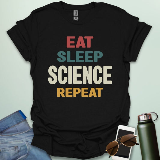 Eat Sleep Science Repeat t-shirt with bold text design — funny science lifestyle shirt for STEM students, teachers, and proud geeks.
