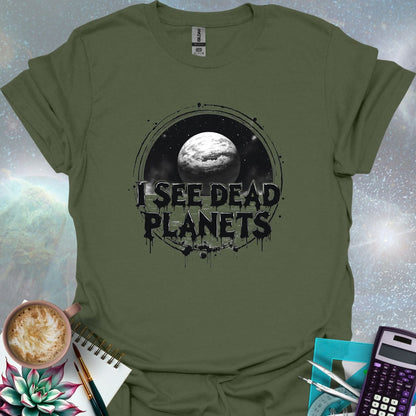 T-shirt design featuring a planet with the text 'I See Dead Planets' in a distressed, gothic font, with splatters and a dark, space-themed background.