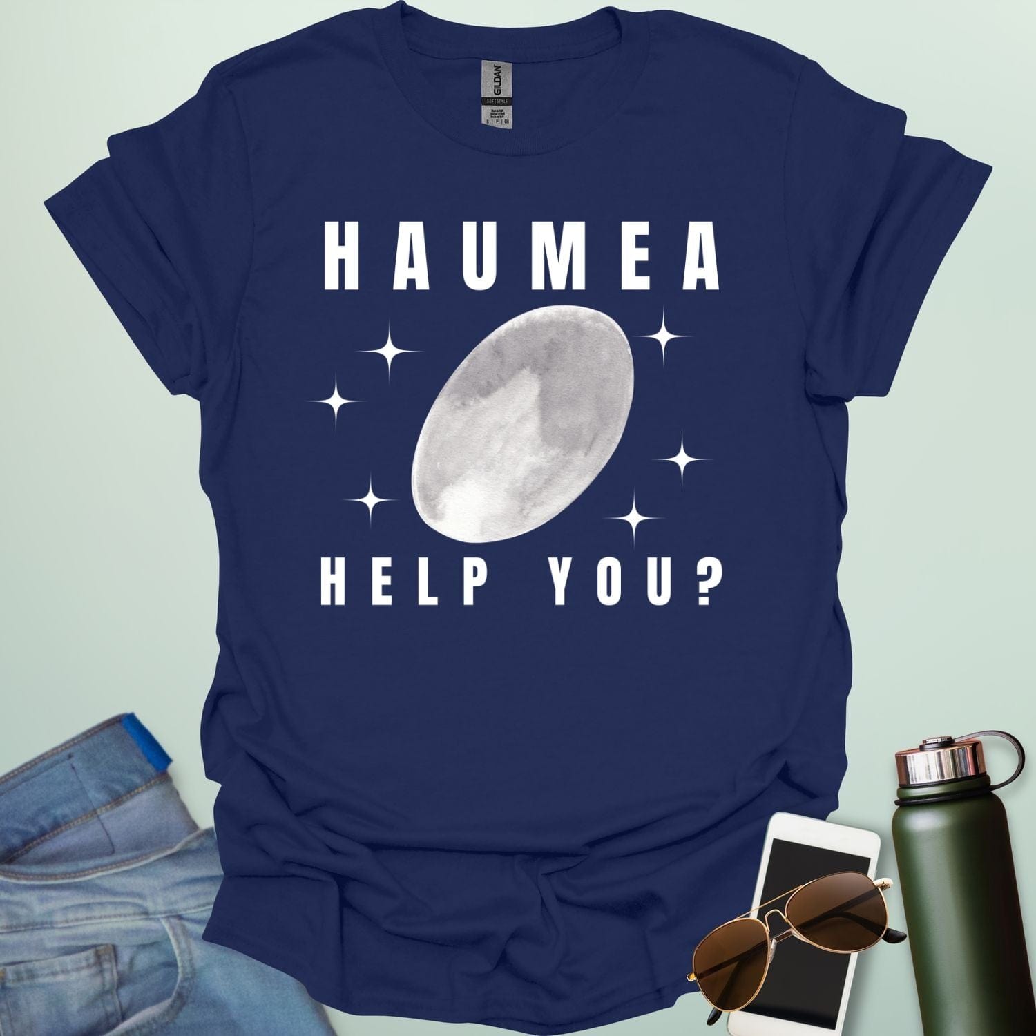 "A navy blue t-shirt with a drawing of the dwarf planet Haumea and the text 'HAUMEA HELP YOU?'