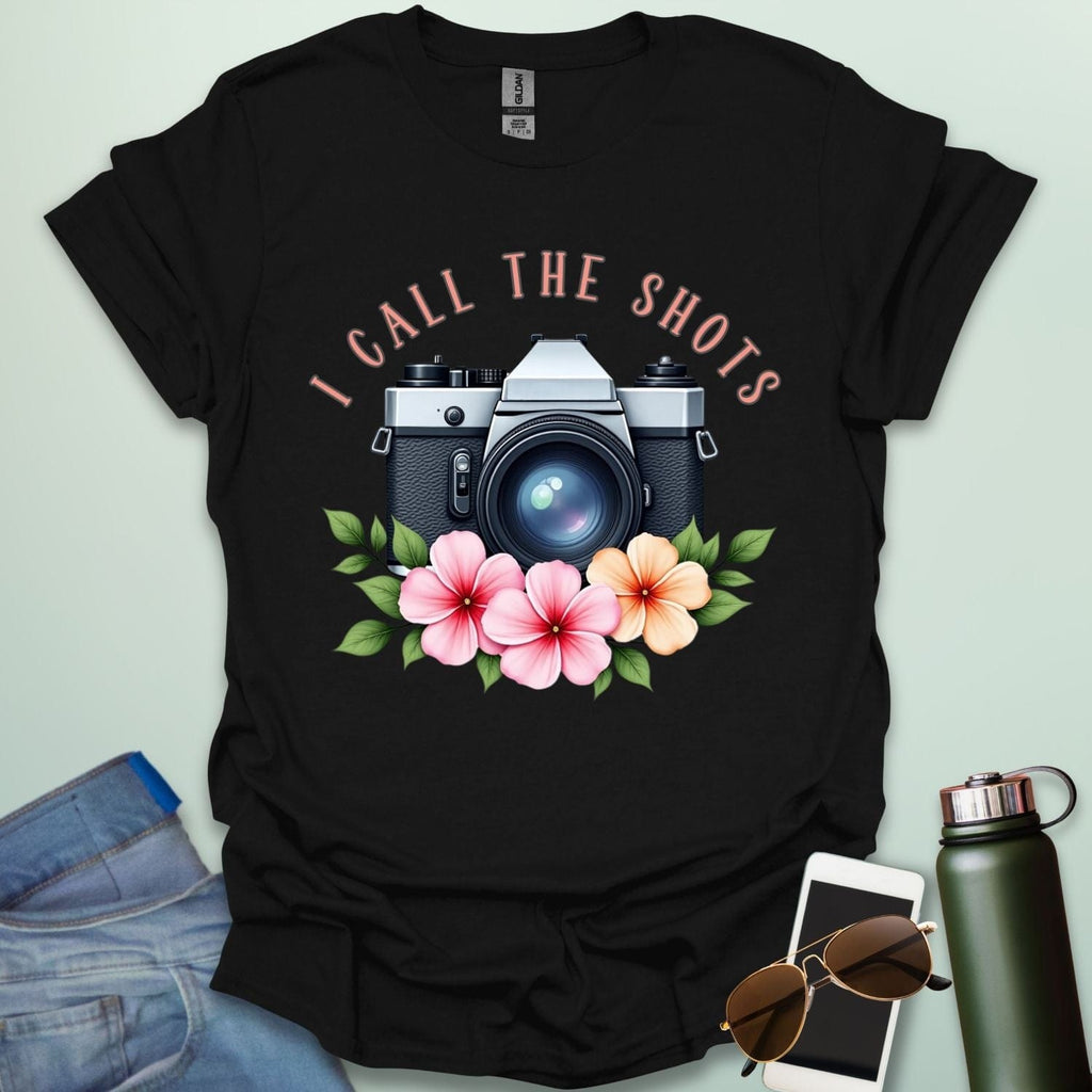 I Call the Shots t-shirt featuring a vintage camera graphic with floral accents — witty photographer humor tee for STEM and art lovers.