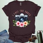 I Call the Shots t-shirt featuring a vintage camera graphic with floral accents — witty photographer humor tee for STEM and art lovers.