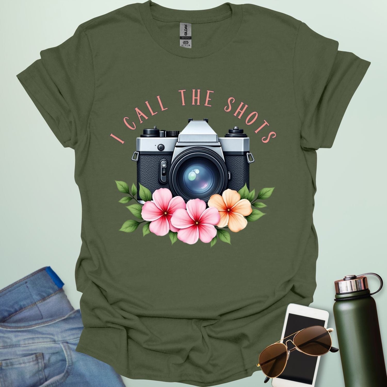 I Call the Shots t-shirt featuring a vintage camera graphic with floral accents — witty photographer humor tee for STEM and art lovers.