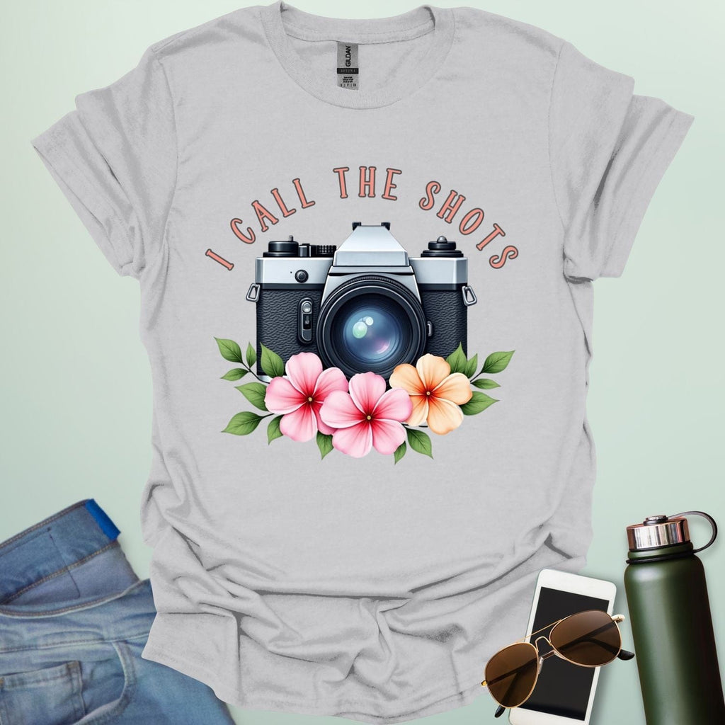 I Call the Shots t-shirt featuring a vintage camera graphic with floral accents — witty photographer humor tee for STEM and art lovers.