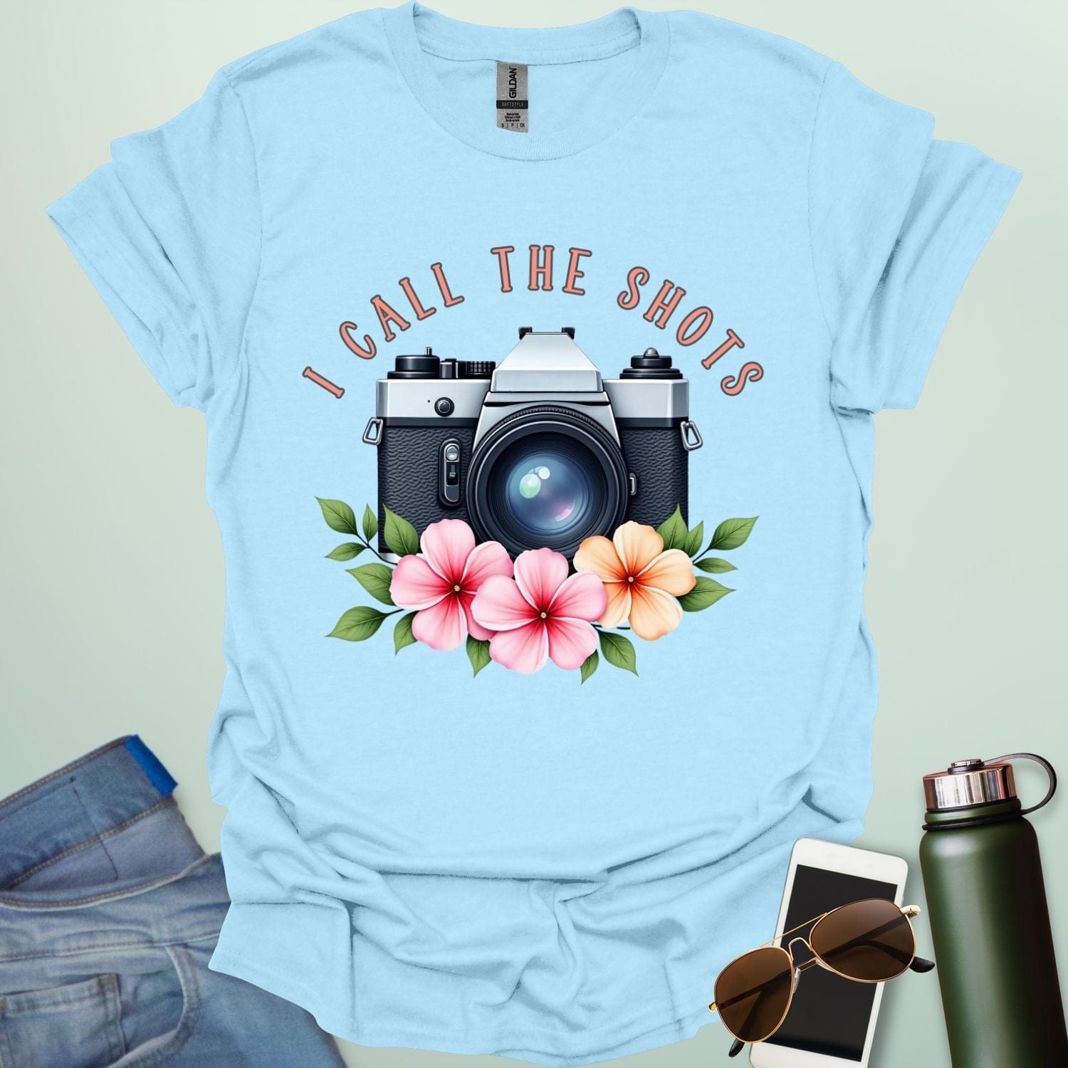 I Call the Shots t-shirt featuring a vintage camera graphic with floral accents — witty photographer humor tee for STEM and art lovers.