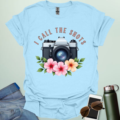 I Call the Shots t-shirt featuring a vintage camera graphic with floral accents — witty photographer humor tee for STEM and art lovers.