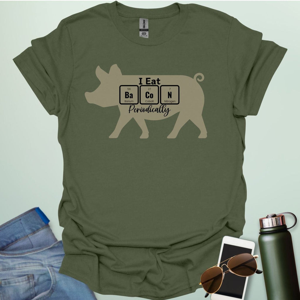 T-shirt design featuring a pig silhouette with the text 'I Eat Bacon Periodically,' where 'Bacon' is spelled using periodic table element symbols.