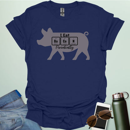 T-shirt design featuring a pig silhouette with the text 'I Eat Bacon Periodically,' where 'Bacon' is spelled using periodic table element symbols.