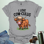 A cute and funny t-shirt featuring a highland cow in a field of flowers and the text 'I Love Cow-culus,' a perfect gift for math teachers and students.