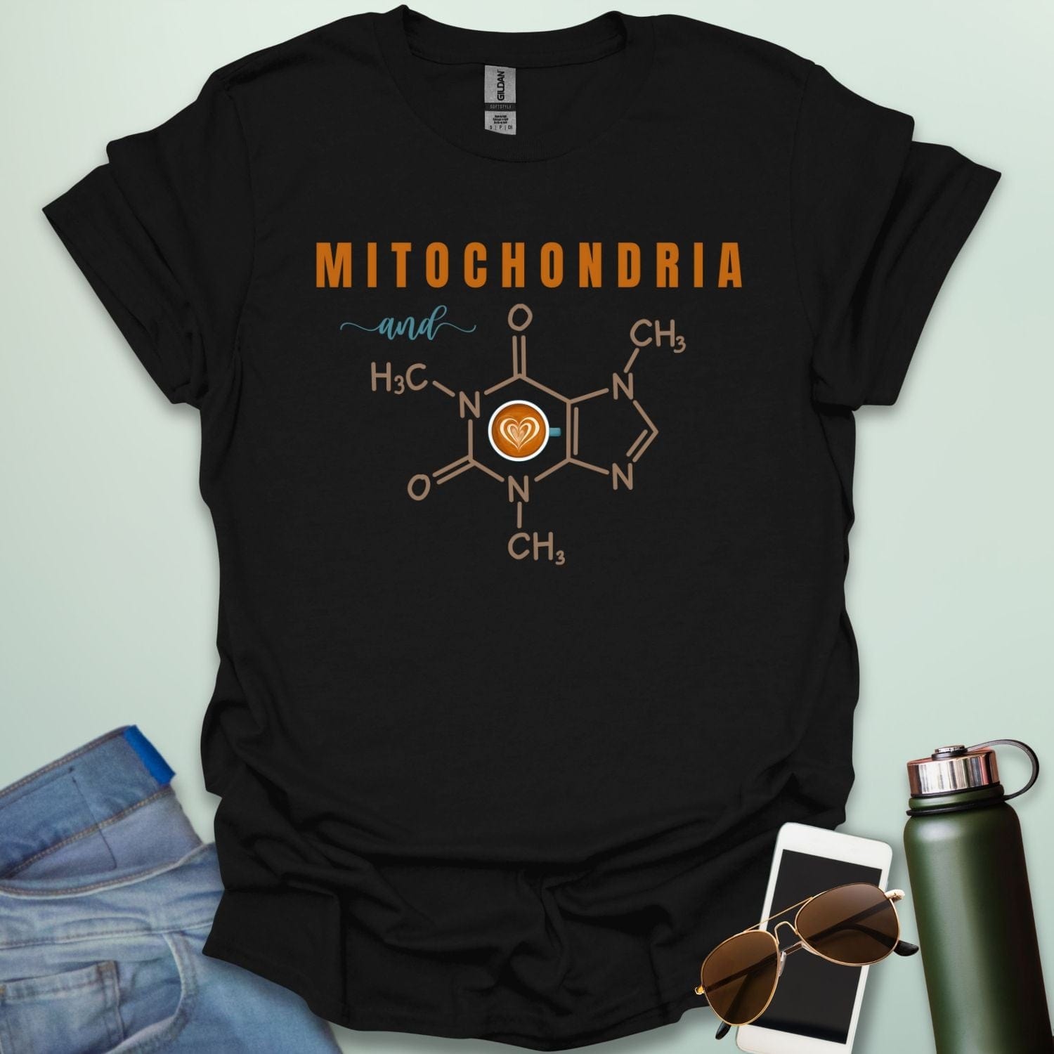 A black t-shirt with the text 'MITOCHONDRIA and' above a graphic of the caffeine chemical structure with a coffee cup icon.