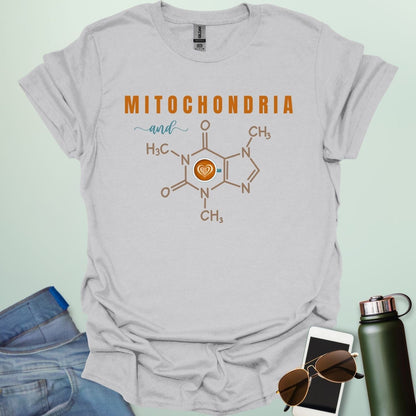 An ice grey t-shirt with the text 'MITOCHONDRIA and' above a graphic of the caffeine chemical structure with a coffee cup icon.