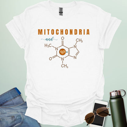 A white t-shirt with the text 'MITOCHONDRIA and' above a graphic of the caffeine chemical structure with a coffee cup icon.
