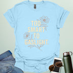 ‘Too Smart to Gaslight’ t-shirt with bold typography — statement tee for thinkers and mental health advocates.