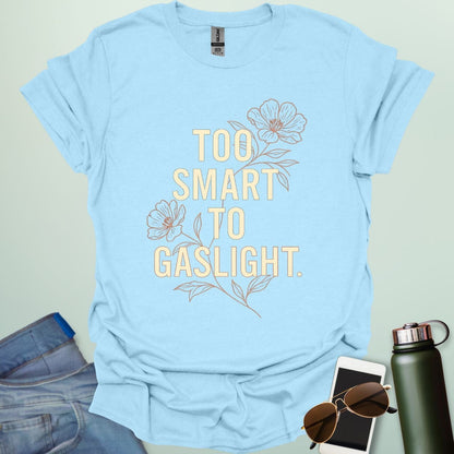 ‘Too Smart to Gaslight’ t-shirt with bold typography — statement tee for thinkers and mental health advocates.