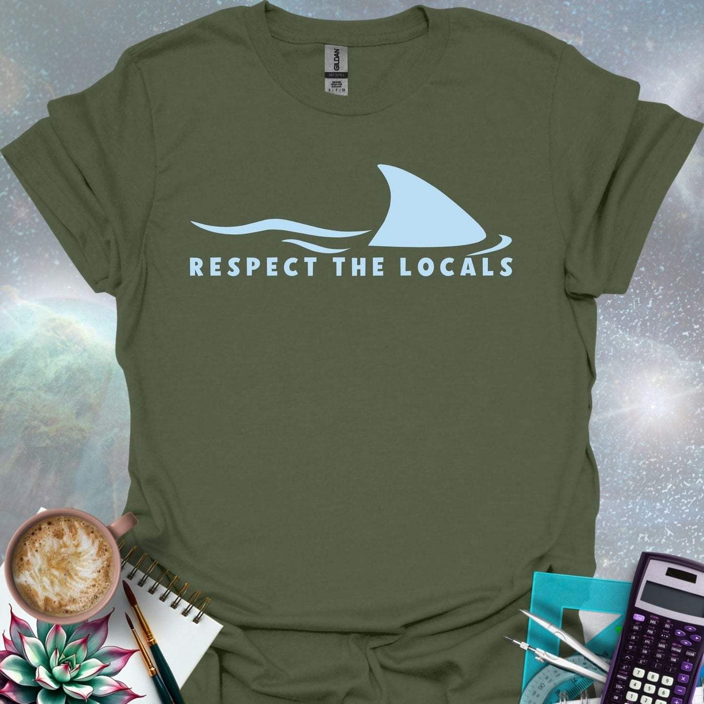 A blue shark fin rising above blue ocean waves, with the text 'RESPECT THE LOCALS' below.