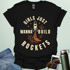 ‘Girls Just Wanna Build Rockets’ t-shirt with rocket illustration — STEM apparel for girls in engineering and space lovers.