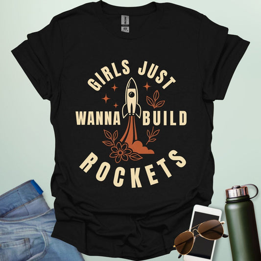 ‘Girls Just Wanna Build Rockets’ t-shirt with rocket illustration — STEM apparel for girls in engineering and space lovers.