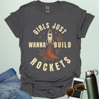 ‘Girls Just Wanna Build Rockets’ t-shirt with rocket illustration — STEM apparel for girls in engineering and space lovers.
