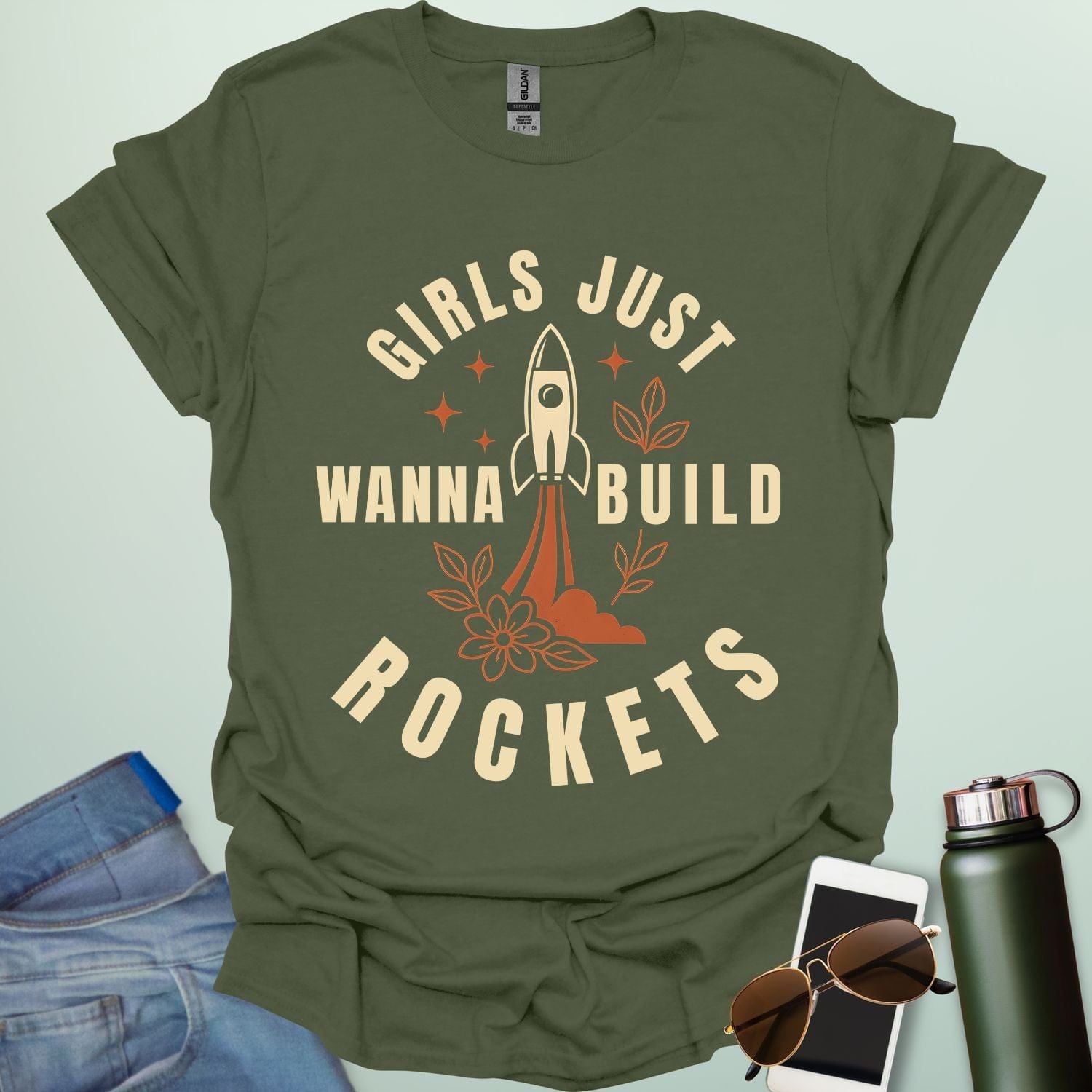 ‘Girls Just Wanna Build Rockets’ t-shirt with rocket illustration — STEM apparel for girls in engineering and space lovers.