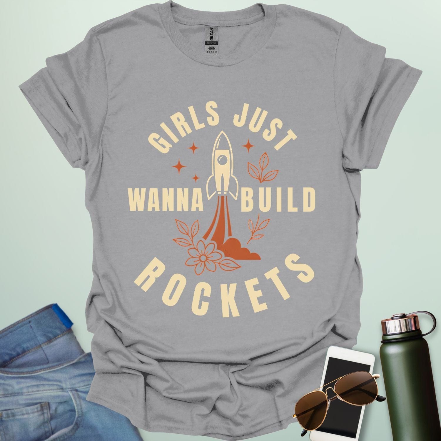 ‘Girls Just Wanna Build Rockets’ t-shirt with rocket illustration — STEM apparel for girls in engineering and space lovers.